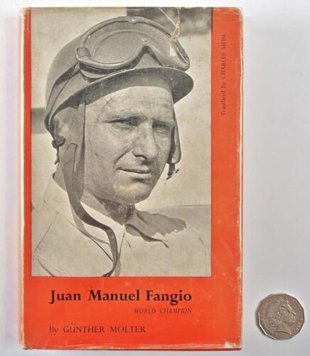 FANGIO: A signed copy of "Juan Manuel Fangio, World Champion" by Gunter Molter, signed in black ink to the flypage by Fangio