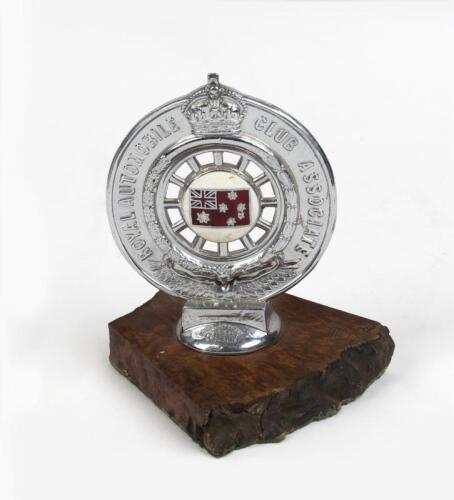 ROYAL AUTOMOTIVE CLUB OF VICTORIA: A circa 1935 Royal Automobile Club of Victoria (RACV) burl wood mounted cast car badge by Stokes & Sons, Melbourne
