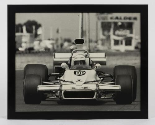MATICH: An original period photograph of Bronwyn Taylor at the wheel of her Matich F5000 at Calder in 1978 by Peter D'Abbs, framed, image 39cm high x 49cm wide