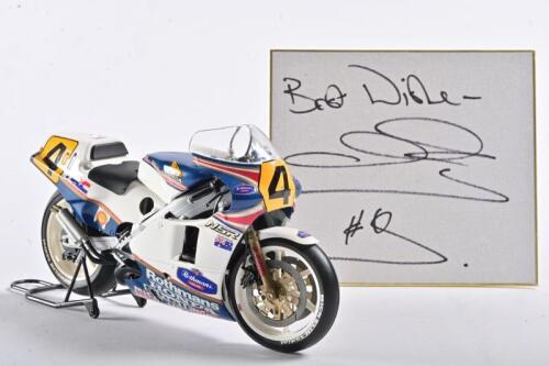 WAYNE GARDNER: A well detailed Honda NSR plastic model on a stand ridden by Wayne Gardner under number 4 along with the card autographed by Wayne Gardner