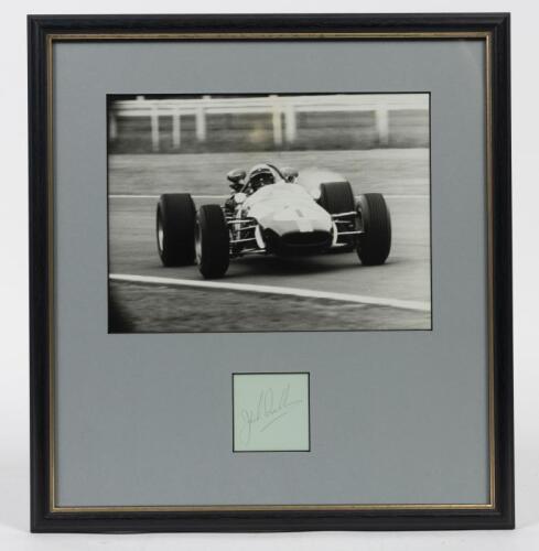 JACK BRABHAM: A framed original photograph and signature of Jack Brabham, window mounted, framed and glazed, 38 x 39cm overall
