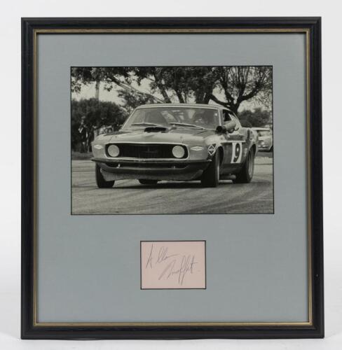 ALLAN MOFFAT: A framed original photograph and signature of Allan Moffat in his Trans Am Mustang at Mallala Races 1970, window mounted, framed and glazed, 44 x 38cm overall