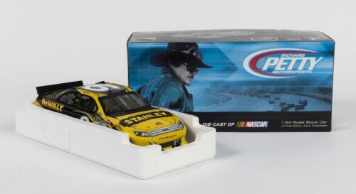 NASCAR: A limited edition Ford and NASCAR licensed 1:24 scale Action Racing Collectables Stanley 2012 Ford Fusion #9 model, signed by nascar driver Marcos Ambrose