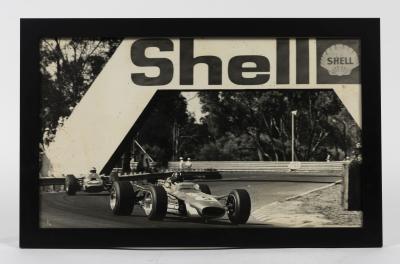 GRAHAM HILL: An original photograph circa 1968 featuring Graham Hill in his Gold Leaf Team Lotus 49 Ford 2.5 DFW at Warwick Farm for the 1968 Tasman Series.