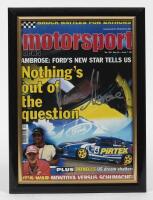 MARCOS AMBROSE / GREG MURPHY: Two framed front covers of Motorsport News signed by Marcos Ambrose and Greg Murphy, framed and glazed, 33.5 x 25cm overall - 2