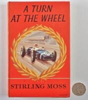 Stirling MOSS: A signed copy of "A Turn At The Wheel" hardcover first edition autobiography, signed in blue ink to the flypage by Stirling Moss