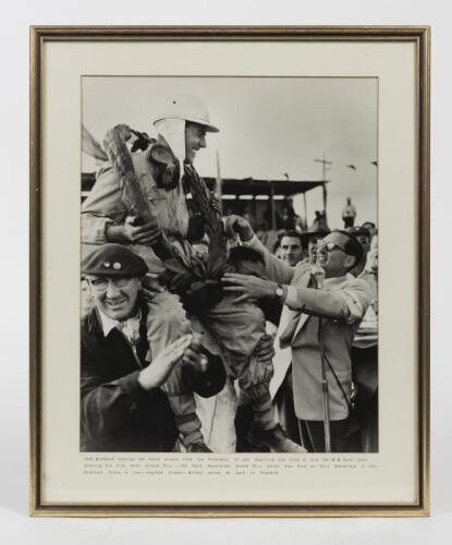 BRABHAM: A period photograph of Sir Jack being presented with wreath by Mr. W.B Rutt (President&nbsp;SCCSA) after winning his first ever Grand Prix being the 1955 AGP at Port Wakefield, mounted, framed and glazed, image 36.5cm high, 29cm wide.