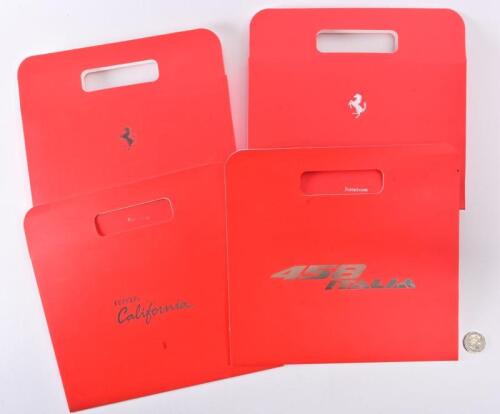 FERRARI: Two 2012 Ferrari hardcover magazines with Factory Passports in carry slip