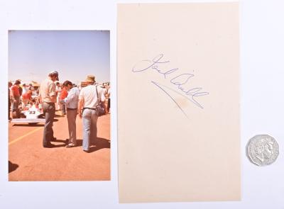 JACK BRABHAM: A signed card by Jack Brabham with an original photo Brabham