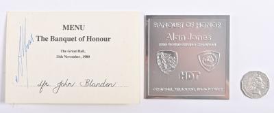 ALAN JONES: A menu from the "Banquet of Honor" for Alan Jones signed by Jones and a plaque commemorating the event