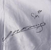 GRAND PRIX: A officially licensed large "Australian Formula 1 Grand Prix Adelaide 1990" flag hand signed by Stewart, Hulme, Fangio, Moss and Brabham, reading; "The 500th World Championship Grand Prix", made by "The flag centre of Australia", 95cm high x 1 - 4