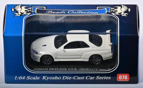 NISSAN: A 1:64 scale NOS Kyosho Nissan Skyline GT-R BNR 34 V-spec II die-cast model