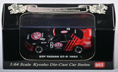 NISSAN: A 1:64 scale NOS Kyosho Nissan STP Taisan GT-R 1993 #2 die-cast model