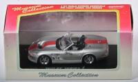SHELBY: A 1:43 scale NOS Kyosho Shelby Series 1 silver/red die-cast model