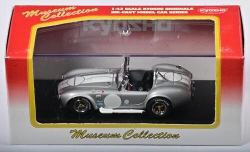 SHELBY: A 1:43 scale NOS Kyosho Shelby Cobra 427 S/C racing silver/white stripes die-cast model