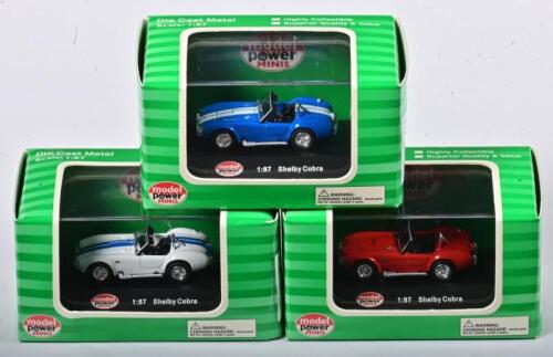 SHELBY: A 1:87 scale NOS Model Power Shelby Cobra including 3 models red, blue with white stripes and white with b