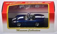 SHELBY: A 1:43 scale NOS Kyosho Shelby Series 1 blue/white die-cast model