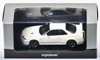 NISSAN: A 1:43 scale NOS Kyosho Nissan Skyline GT-R V-spec II BNR34 white pearl die-cast model