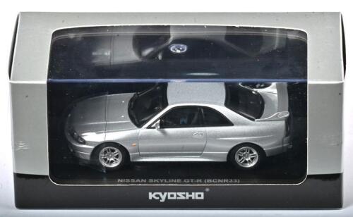 NISSAN: A 1:43 scale NOS Kyosho Nissan Skyline GT-R BCNR33 1995 spark silver die-cast model