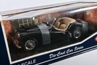 TRIUMPH: A 1:18 scale NOS Kyosho Triumph TR3A black die-cast model - 2