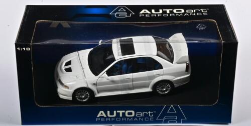 MITSUBISHI: A NOS 1:18 scale Autoart Mitsubishi Lancer EVO VI - white, die-cast model
