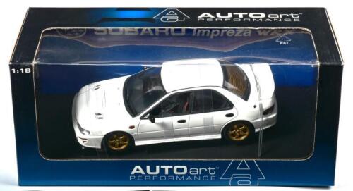 SUBARU: A NOS 1:18 scale Autoart Subaru Impreza WRX 4 Door - white, die-cast model
