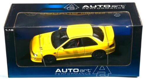 SUBARU: A NOS 1:18 scale Autoart Subaru Impreza WRX Type R - yellow, die-cast model