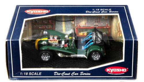CATERHAM: A 1:18 scale NOS Kyosho Caterham Super Seven british racing green/yellow stripe die-cast model