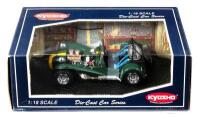 CATERHAM: A 1:18 scale NOS Kyosho Caterham Super Seven british racing green/yellow stripe die-cast model