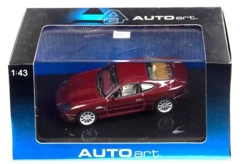 ASTON MARTIN: A 1:43 scale NOS Autoart Aston Martin DB7 Vantage red die-cast model