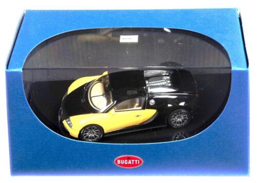BUGATTI: A 1:43 scale NOS Autoart Bugatti EB 16.4 veyron showcar black/yellow die-cast model