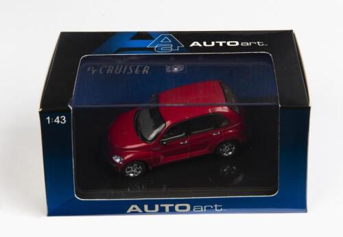 CHRYSLER: A 1:43 scale NOS Autoart Chrysler PT Cruiser red die-cast model