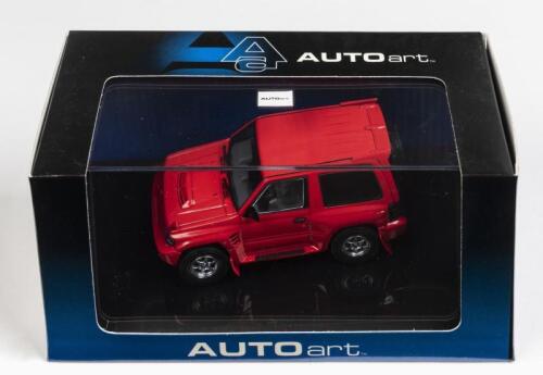 MITSUBISHI: A 1:43 scale NOS Autoart Mitsubishi Pajero Evo red die-cast model