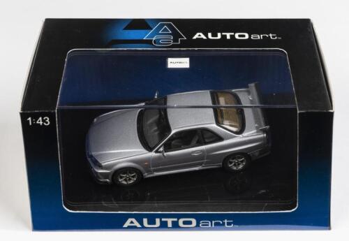 NISSAN: A 1:43 scale NOS Autoart Nissan Skyline R34 GTR 1999 silver die-cast model