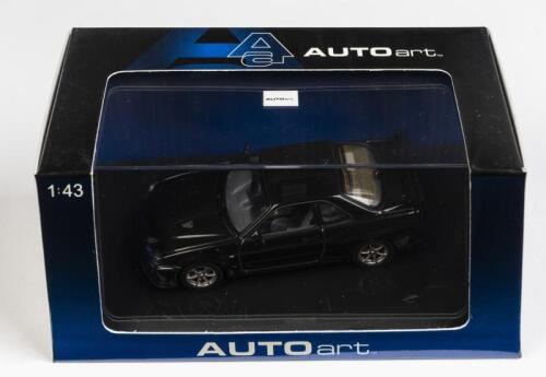 NISSAN: A 1:43 scale NOS Autoart Nissan Skyline R34 GTR V-Spec LI sparkling black pearl die-cast model