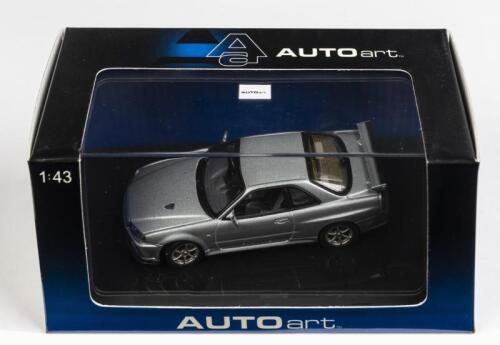 NISSAN: A 1:43 scale NOS Autoart Nissan Skyline R34 GTR V-Spec LI sparkling silver die-cast model