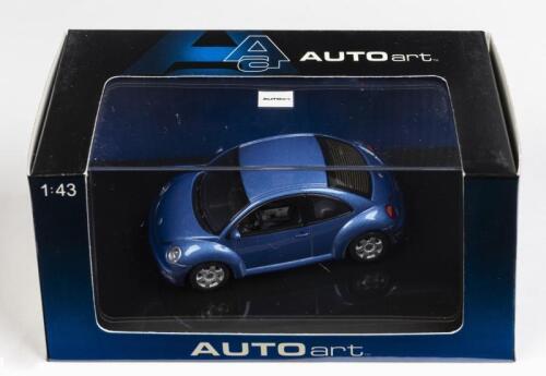 VOLKSWAGEN: A 1:43 scale NOS Autoart Volkswagen New Beetle blue die-cast model