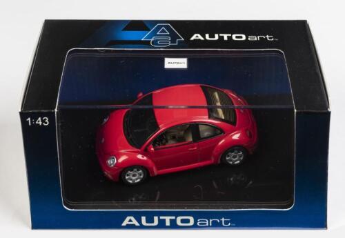 VOLKSWAGEN: A 1:43 scale NOS Autoart Volkswagen New Beetle red die-cast model