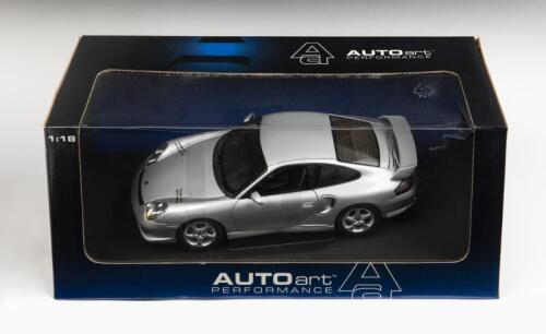 PORSCHE: A 1:18 scale NOS Autoart Porsche 911 GT2 2002 silver die-cast model