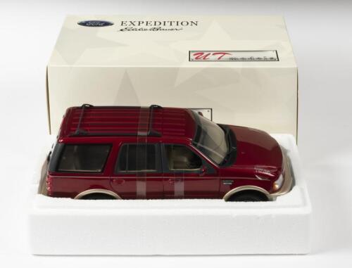 FORD: A NOS 1:18 scale UT Models Ford Expedition "Eddie Bauer Version" - Metallic Red, die-cast model