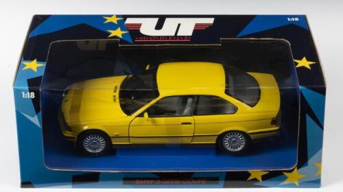 BMW: A NOS 1:18 scale UT Models BMW 3 Series Coupe - Yellow, die-cast model