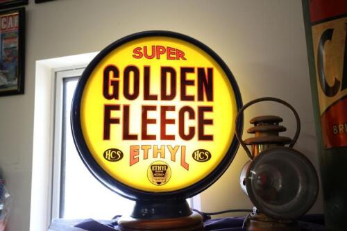 GOLDEN FLEECE: A reproduction double sided "Super Golden Fleece" glass and metal bowser globe, fitted for electricity, 50cm high