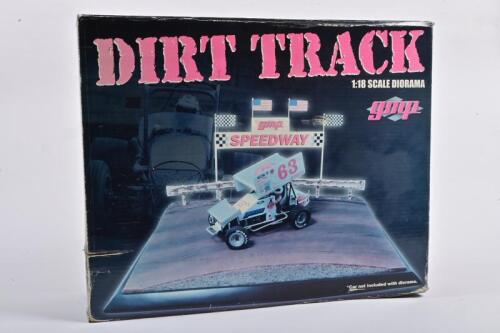 DIORAMA: A NOS 1:18 scale GMP Resin Diorama Sprint Car Dirt Track; Comprises Dirt Track Base, 4 Drivers, Railing, Poles & Flags: Diorama Dimensions 18" x 9" x 14"