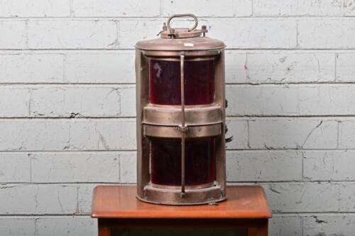 LANTERN: An early large twin light brass ships lantern&nbsp;with ruby glass lenses, 45cm high