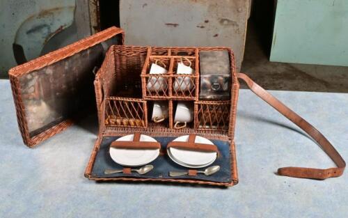 PICNIC SET: A fitted porcelain, glass and silver plate picnic set in wicker basket, porcelain translucent and unbranded, likely Japanese circa 1930s, 21cm high, 36.5cm wide, 21.5cm deep