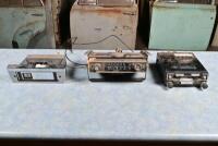 CAR RADIOS: Three assorted car radio retated items including removal Sanyo unit, Sharp cassette unit and AWA carrier