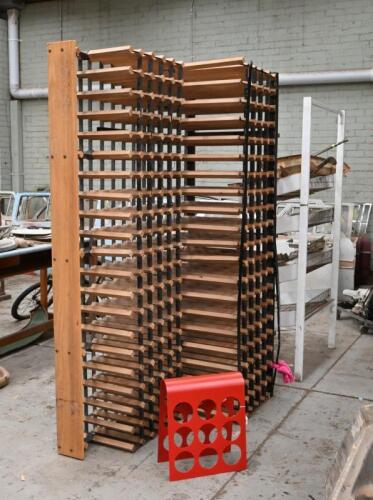 WINE: Two wine racks, one in red, the other large in metal and timber