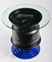 PORSCHE: A etched glass and metal coffee table in the form of a Le Mans Porsche wheel, being a rare six-spoke Porsche 956 962 magnesium alloy racing wheel, ex Rothmans Porsche 1984 Sandown 1000 FIA World Endurance Championship race (see image of CoA added