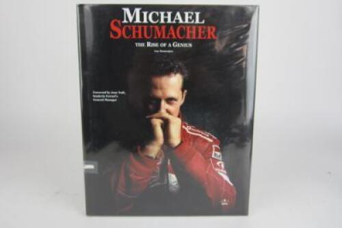 MICHAEL SCHUMACHER: A hardcover book titled 'Michael Schumacher, The Rise of a Genius' by Lue Domenjoz (signed Schumacher)