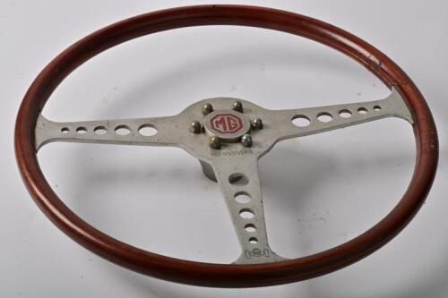 STEERING WHEEL: A sports car metal and timber steering wheel with MG medallion, 40cm overall diameter